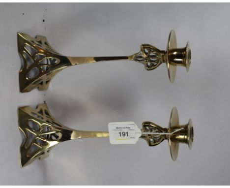 A pair of Art Nouveau style brass candlesticks, 25cm high