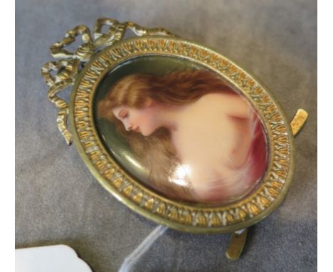 A miniature portrait of a young lady on porcelain