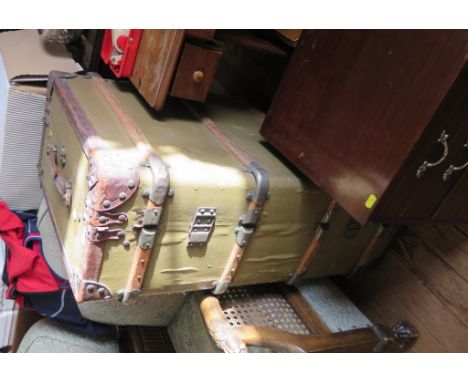 A leather and timber bound travelling trunk