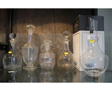 A pair of mallet shaped glass decanters with stoppers, a Royal Worcester Grand Chateau decanter (boxed) and two other decante