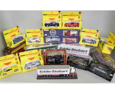 A collection of boxed Die Cast vehicles to include Eddie Stobbart, Esso, Corgi, Kimberly Clark, Sportscar, and other examples
