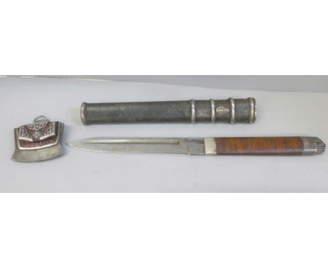 A Tibetan Mechak fire lighter, early 19th Century, (possibly 18th), and a Tanto dagger with leather and white metal mounted s
