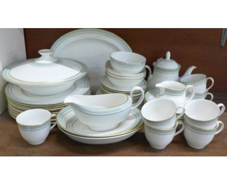 A Royal Doulton Berkshire tea and dinner service, 11 dinner plates, 7 tea plates, 7 saucers, 7 cups, 4 bowls, tureen, tea pot