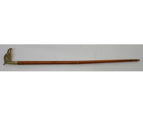 A wooden walking stick with brass eagle handle 