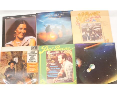 A box of LP vinyl records and 7" singles, to include Dolly Parton, Johnny Cash, Rita Coolidge, The Electric Light Orchestra, 
