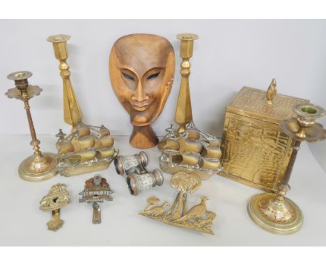 A pair of Victorian brass candlesticks, one other pair of candlesticks, tea caddy, a pair of brass book ends, a pair of binoc