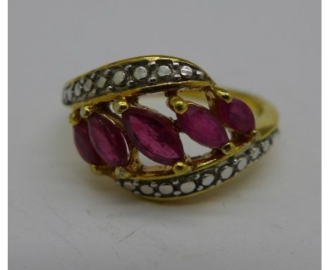 A silver gilt and ruby ring, O