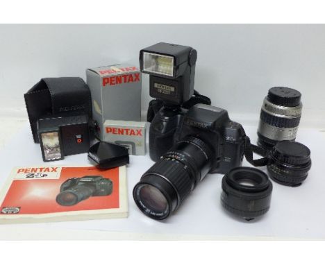 A Pentax Z-IP digital/manual camera, four Pentax lenses including Pentax-M 1:3.5 135mm, Pentax 28-80, Pentax A 1:2 50mm, Pent