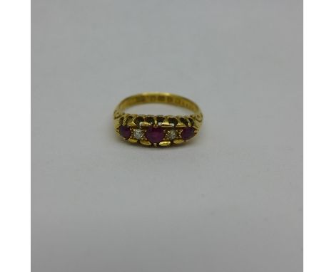 An 18ct gold, ruby, diamond and white stone ring, one diamond replaced, 3.1g, L