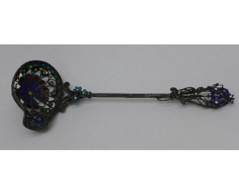 An enamelled pierced decorative ladle