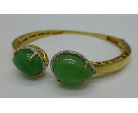 A silver gilt, jade and diamond bangle