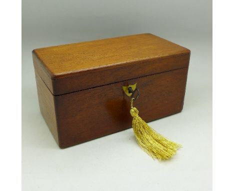A mahogany tea caddy