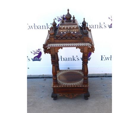 Indian rosewood and bone inlaid centre display, the tiered top with turned finials above turned supports square shelf with sh