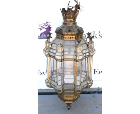 Middle Eastern style pierced metal and glass ceiling light, with pineapple finials (one missing), H. 94cm.       