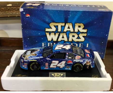 STAR WARS: A 1:18 scale boxed model of a Chevrolet Monte Carlo with Star Wars livery. Est. £30 - £40.