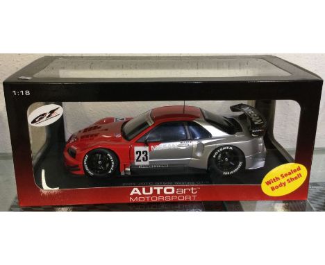 AUTOART: A 1:18 scale boxed model race car of a 2003 JGTC GT500 Skyline GT-R. Est. £30 - £40.