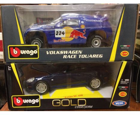 BBURAGO: Two 1:18 scale boxed model cars. Est. £20 - £30.