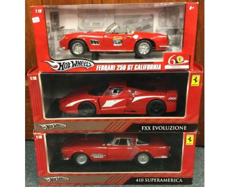 HOT WHEELS: Three 1:18 scale boxed model Ferrari cars. Est. £20 - £30.