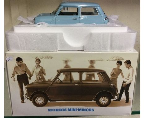 A 1:18 scale boxed model entitled "Morris Mini-Minors". Est. £30 - £40.