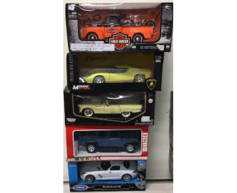 Five various 1:18 scale boxed model cars. Est. £20 - £30.