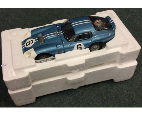 RACE LEGENDS: A good Cobra Datona 1:18 scale unboxed model car. Est. £30 - £40.