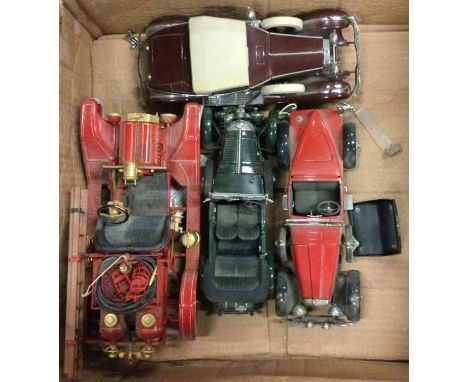 Four 1:24 scale vintage unboxed model cars. Est. £20 - £30.