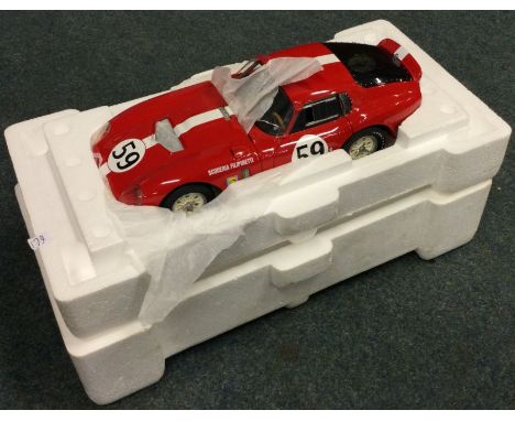 RACE LEGENDS: A Cobra Datona 1:18 scale unboxed model car. Est. £30 - £40.
