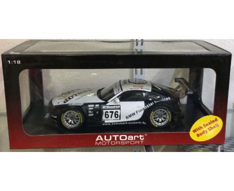 AUTOART: A 1:18 scale boxed model race car of a BMW Z4 Coupe. Est. £30 - £40.