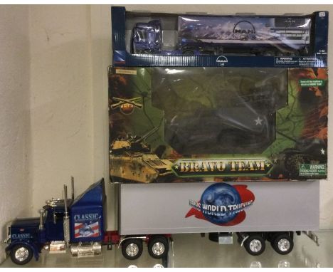 MAN: A 1:43 scale boxed model of a Long Hauler together with other articulated lorries. Est. £20 - £30.