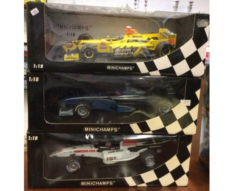 MINICHAMPS: Three 1:18 scale boxed model Formula One cars. Est. £30 - £40.