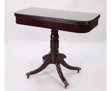REGENCY MAHOGANY PEDESTAL FOLD-OVER TEA TABLE, with D shaped top, heavy ring turned column and downswept supports with hairy 