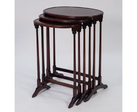 JOHN TUCKER &amp; SON, KENSINGTON, NEST OF THREE EARLY TWENTIETH CENTURY MAHOGANY OCCASIONAL TABLES, each with raised border 
