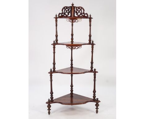 VICTORIAN BURR WALNUT FOUR TIER CORNER WHAT NOT, of graduated form with scroll pierced back, turned supports and pierced pane