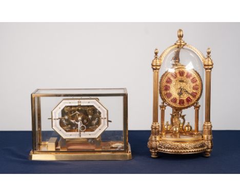 KERN, MODERN REPRODUCTION GILT METAL ANNIVERSARY CLOCK, with twelve part Roman dial and glass case enclosed by three fluted c