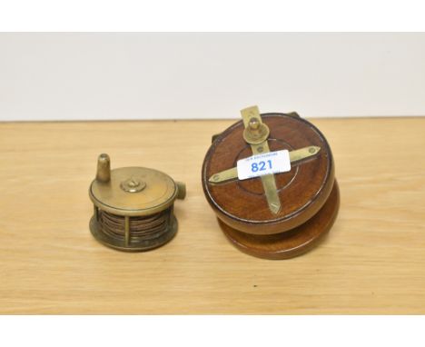 Two vintage fishing reels in lovely condition one wood and brass and the other a small brass trotting reel with no visable ma