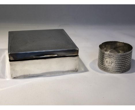 A silver cigarette box of square form, Birmingham 1937, makers mark W.T.T &amp; Co for W T Toghill &amp;Co, 9cm; and a silver