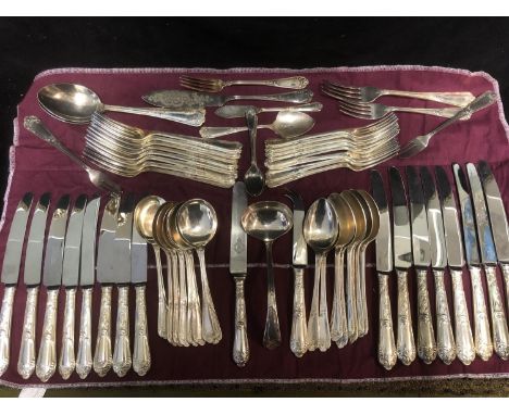 A matched set of La Regence pattern silver plated cutlery, the handles cast with scrolling foliage beneath shell form termina