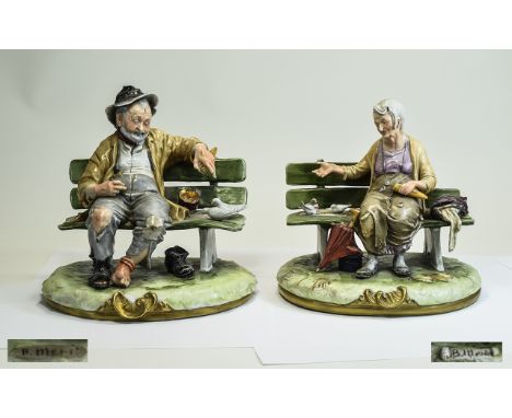 Pair of Capodimonte Glazed Figures of a Tramp Couple, each signed B.Merli; the dishevelled figures, each seated on a bench ar