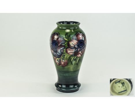 W. Moorcroft Signed Vase ' Clematis ' Design on Emerald Green Ground. Stands 7.25 Inches. Has been restored. 