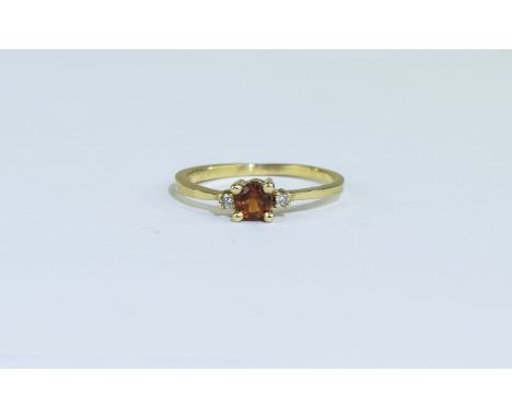 14ct Gold Dress Ring set with a central round fire opal between 2 round cut diamonds. Stamped 14K. Ring size K.