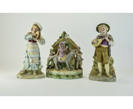 Pair of German Bisque Country Folk Figures playing instruments, 13 inches in height. Together with Bisque figural group depic
