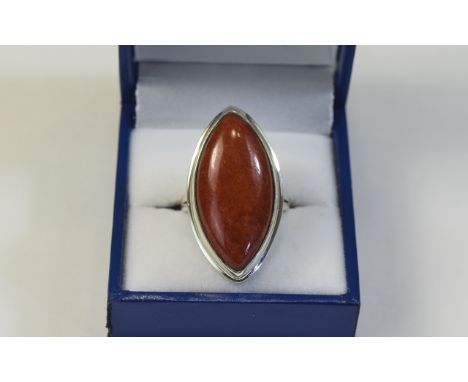 Red Jade Solitaire Ring, a marquise shape cabochon of 24cts in a simple silver bezel setting, placing all the emphasis on the