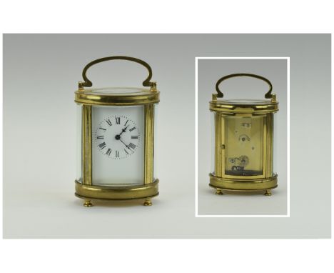 French 19th Century Quality and Shaped Brass Carriage Clock With Glass Panels. Visible Escapement with Porcelain Dial. 5.5 In