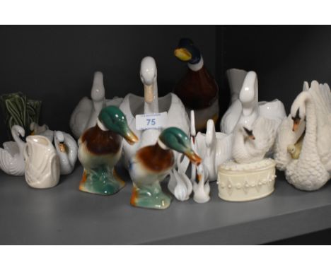 A collection of ceramic ducks and swans.