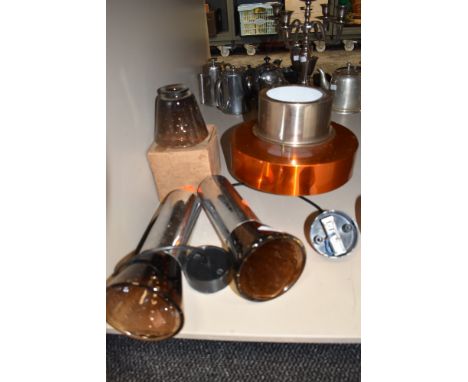 A selection of retro light fitting, including wall mounted with brown bubble glass shades.