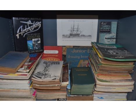 A shelf full of engineering magazines and similar an a boxed Junior engineers drawing board and instruments.