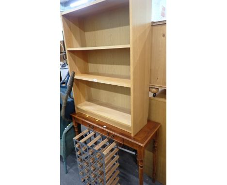 A beech effect three shelved bookcase, walnut console table, and a wine rack. (3) 