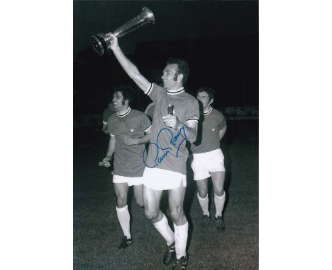 Autographed PAUL REANEY 12 x 8 Photograph : B/W, depicting a wonderful image showing Leeds United full-back PAUL REANEY holdi