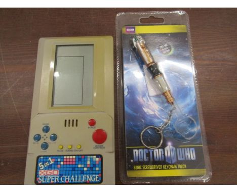 Retro hand held games console and a Dr Who sonic screwdriver torch