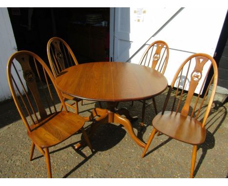 Ercol swan back chairs and extendable table with table protector 98x110cm with 38cm extension leafIn good condition